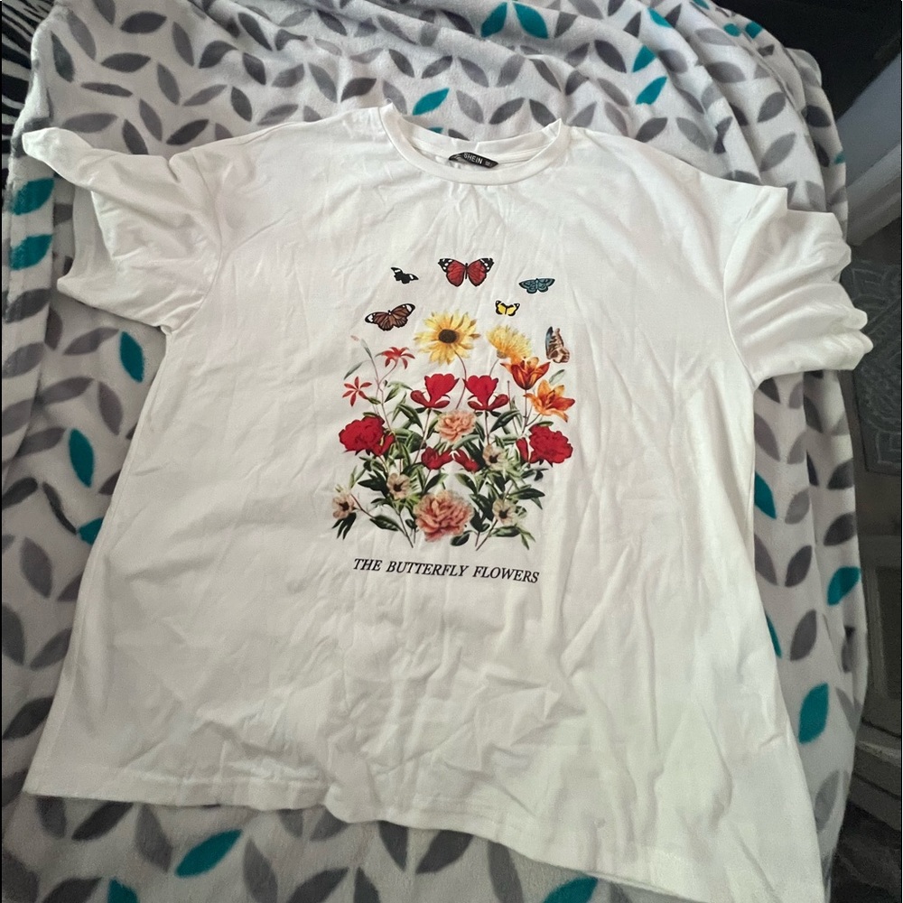 white shirt with flowers and butterflies